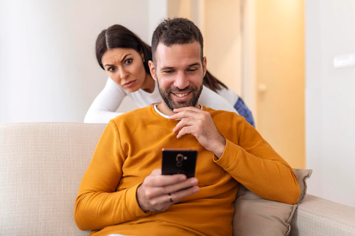 Girl peeking at her partner's phone